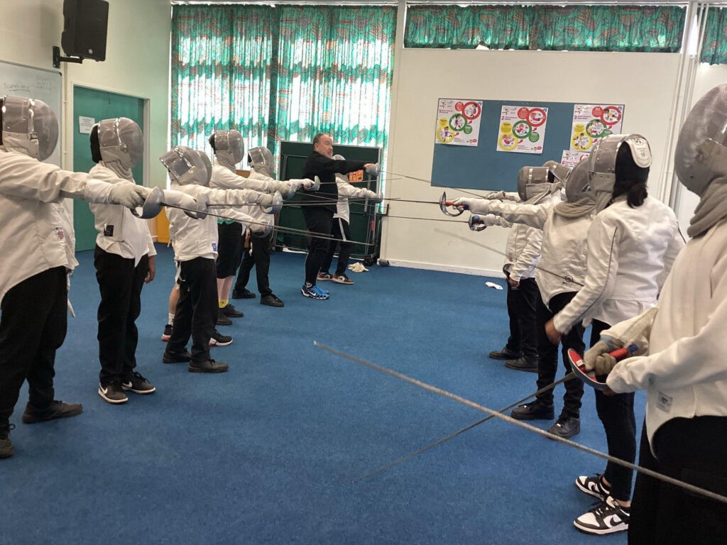 Evergreen pupils lock swords in fencing session