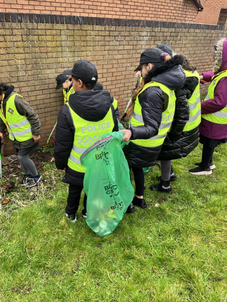 Mini police litter pick local community